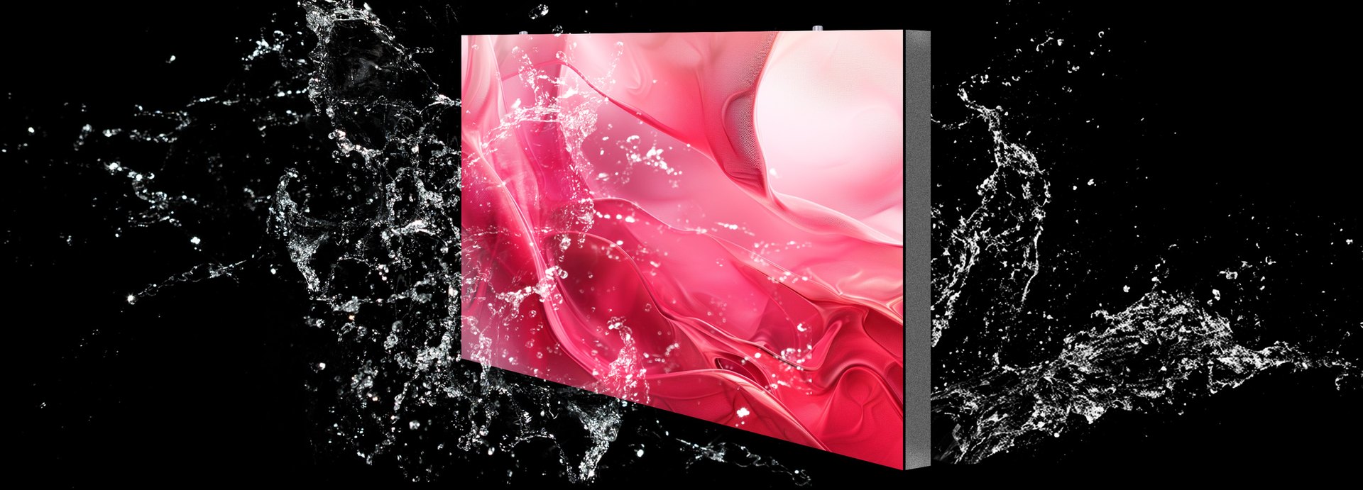 A Durablaze LED cabinet viewed edge-on, its panel lit, water breaking across the face