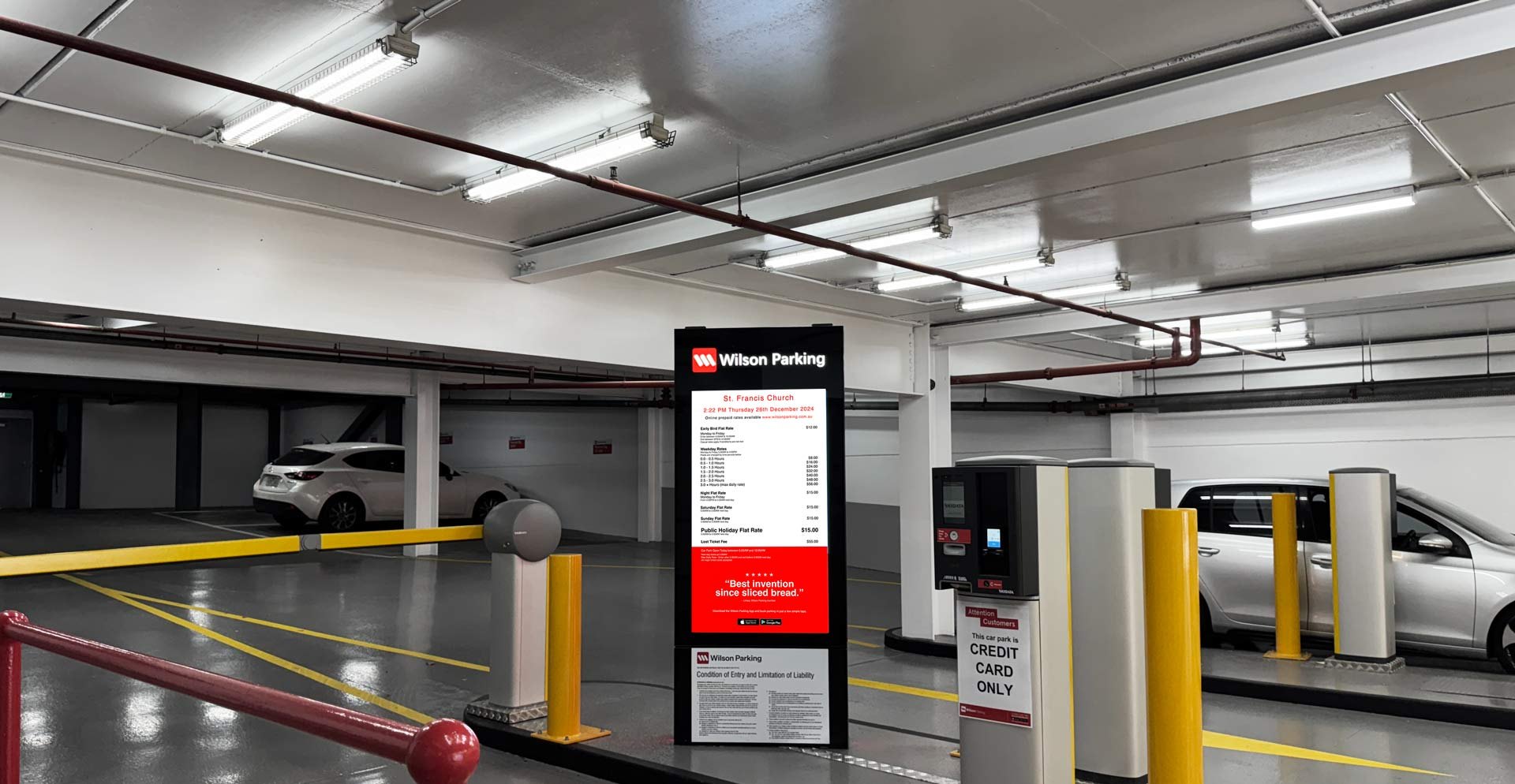 A carpark rates display at the entry boom