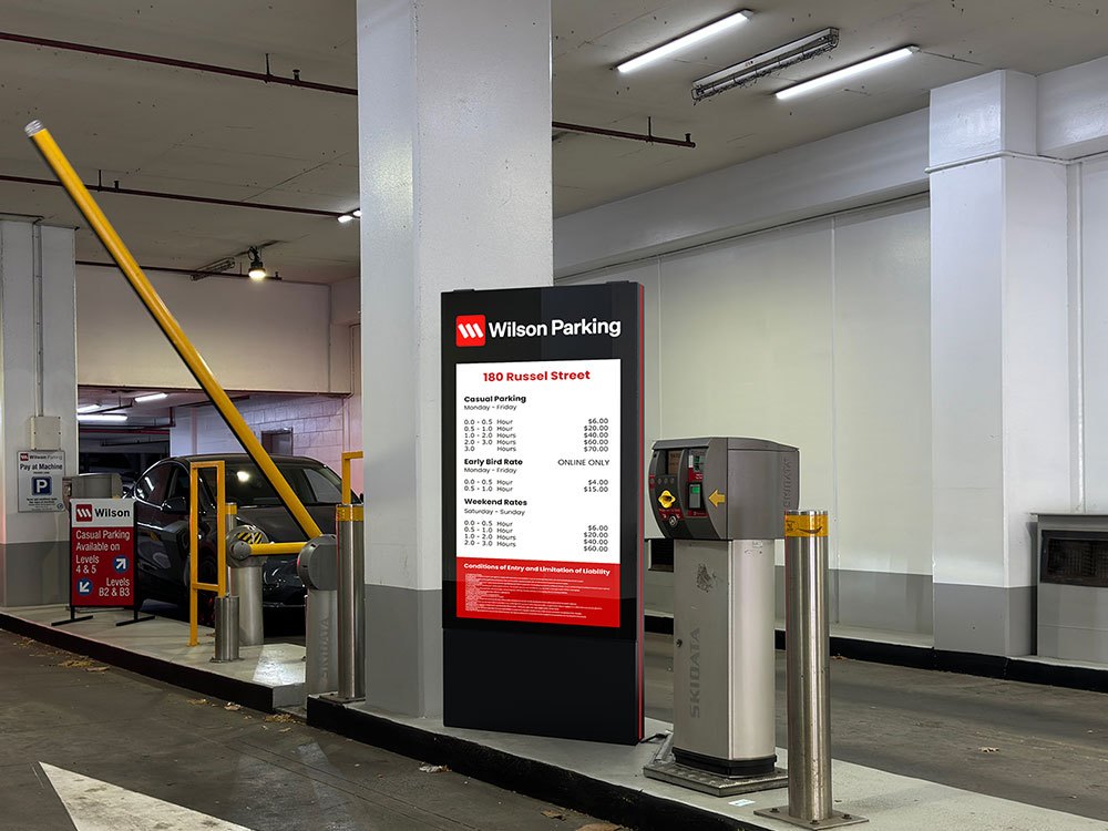 A digital rate board at a car park entrance