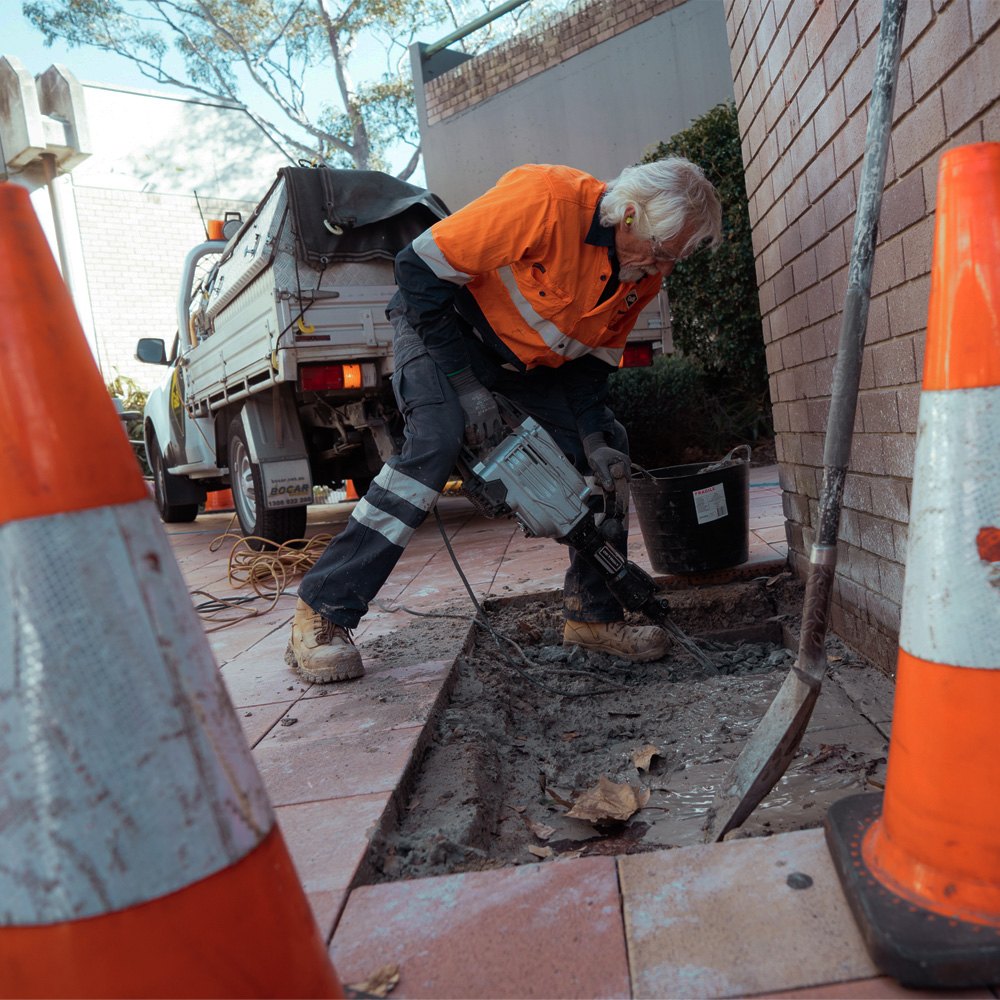 A crew installing a digital sign in a public street