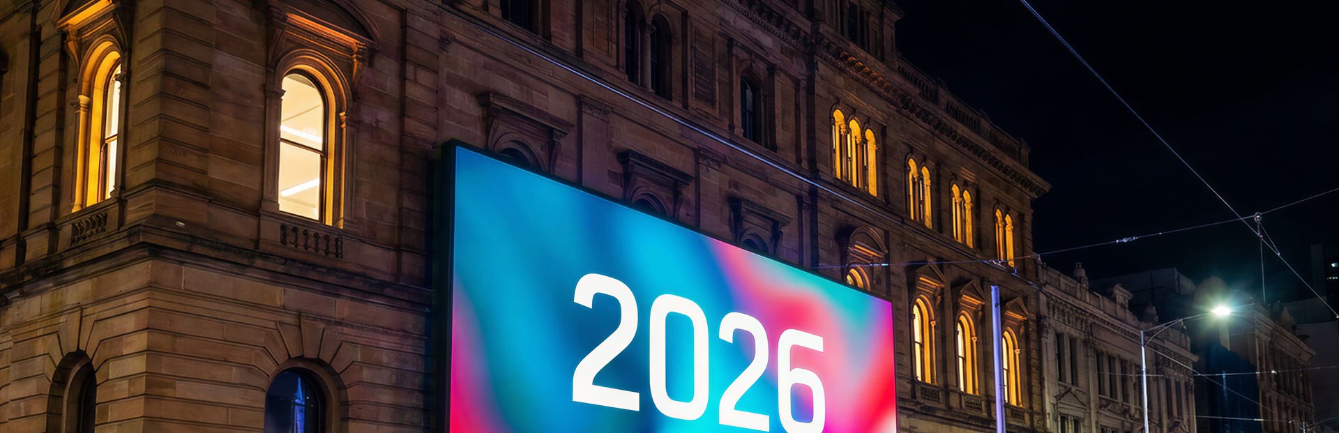 A TINNOX LED video wall lighting a heritage streetscape at night