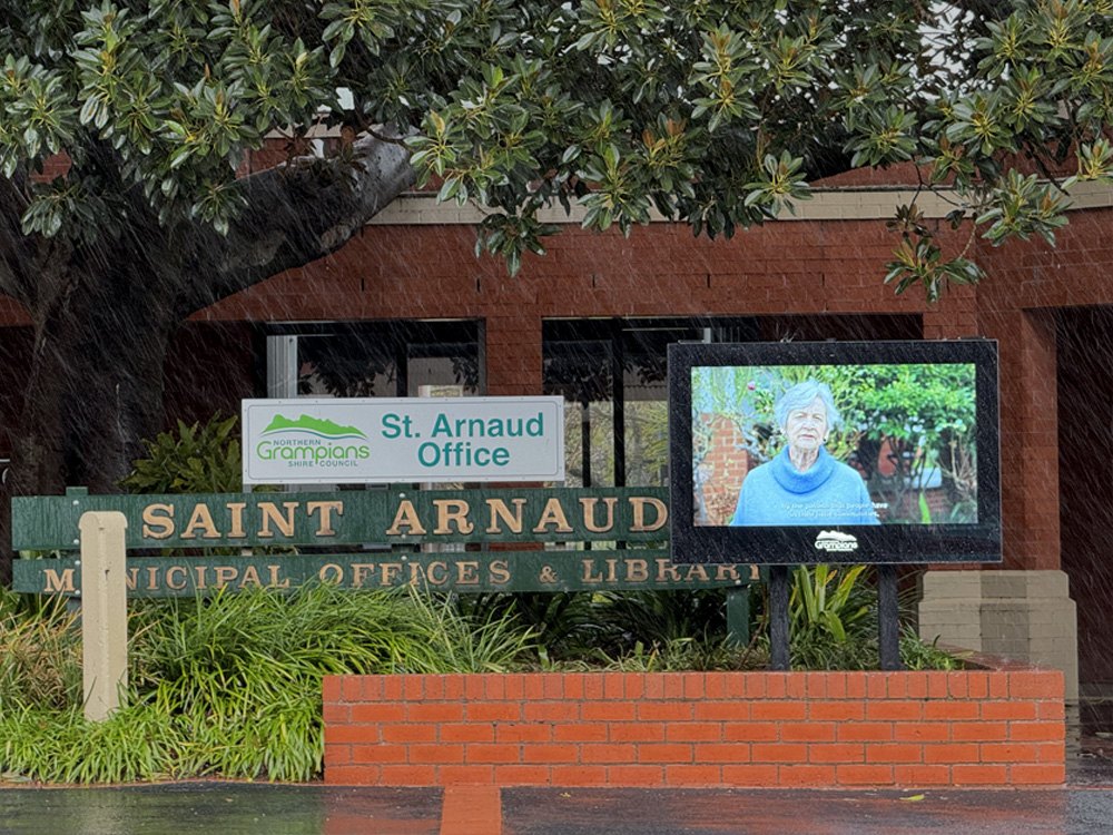 Landscape-oriented digital signage at a building entrance