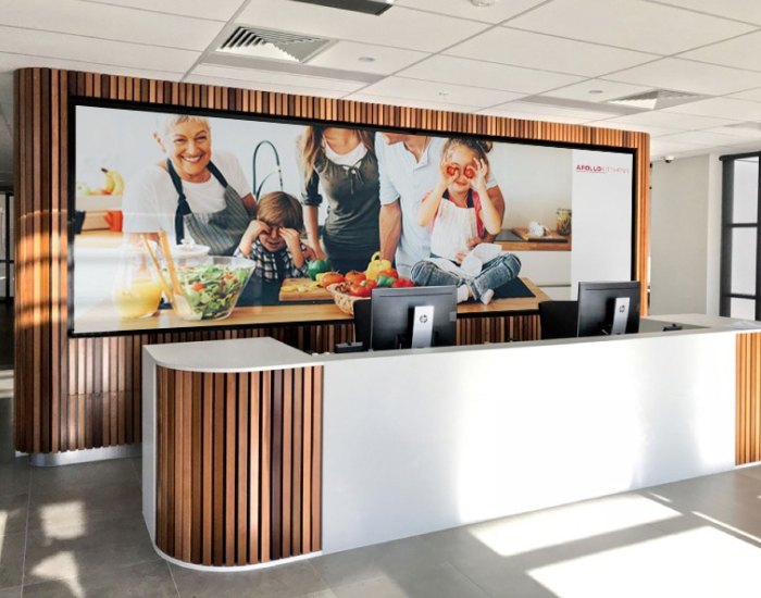 LED video wall behind the reception desk at Apollo Kitchens, Sydney