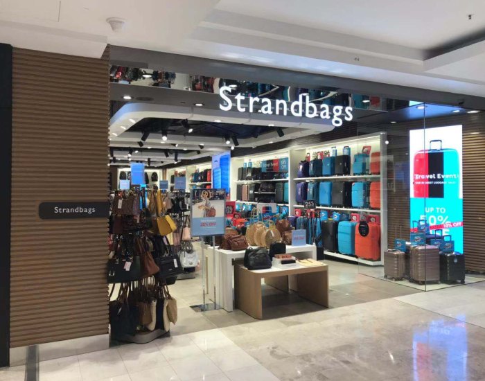 Strand Bags shop entrance in Sydney with an LED display