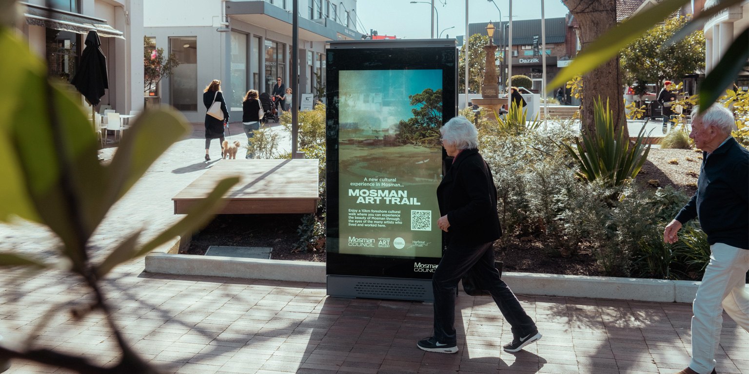 An accessible outdoor kiosk at standing height on a footpath
